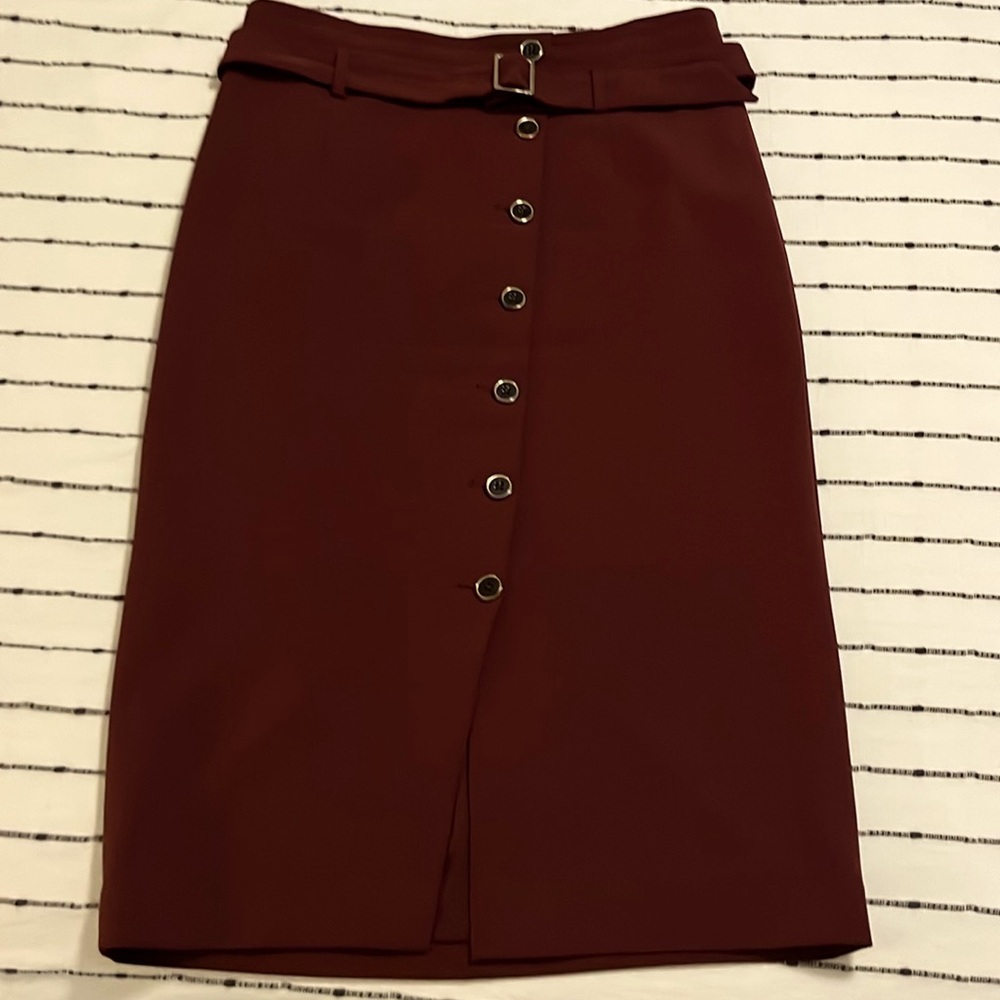 Like new burgundy WHBM pencil skit with buttons and belt. Lined size 10